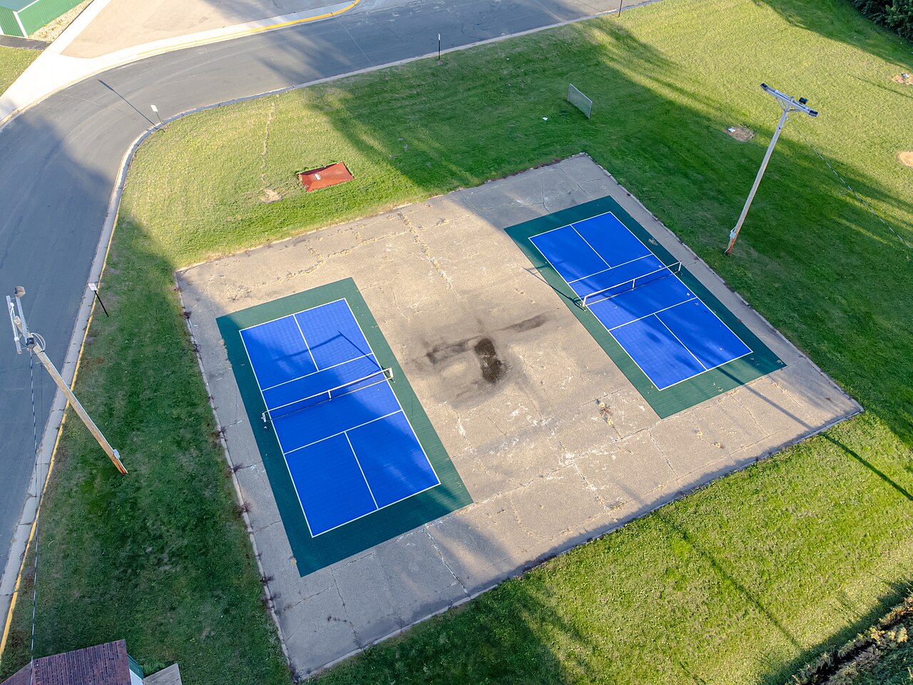 An aerial view of outdoor pickleball courts, illustrating the kind of venue featured in the winter tournament calendar; not a Florida event photo.
